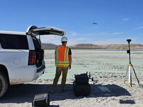 A researcher uses a drone to investigate mine tailings