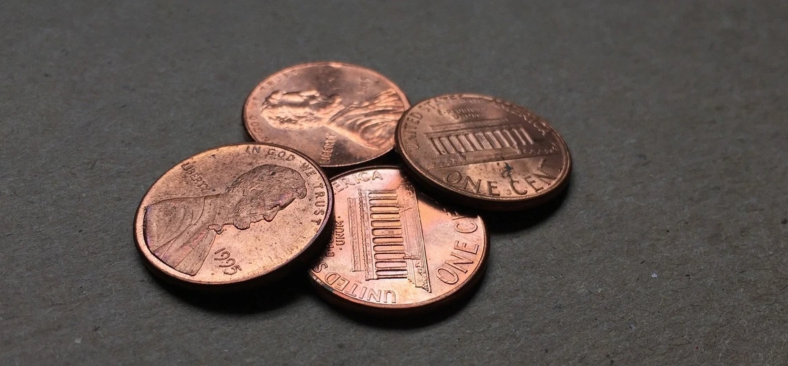 A close-up image of four pennies