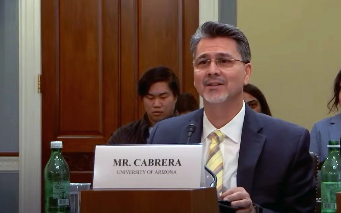 A man with salt and pepper hair speaks in a congressional hearing.