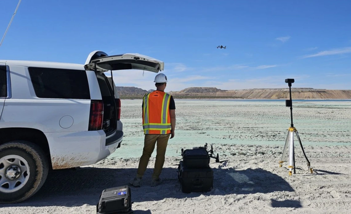 A researcher uses a drone to investigate mine tailings
